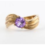 A 9ct yellow gold amethyst set dress ring size N, 3.3 grams
