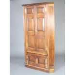 A Georgian open double corner cabinet with moulded cornice and rounded back, the interior fitted