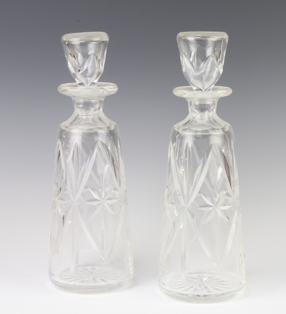 A pair of tapered decanters and stoppers 30cm