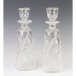 A pair of tapered decanters and stoppers 30cm