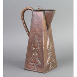 An Art Nouveau square embossed and waisted copper jug with hinged lid 20cm h x 11cm