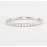 An 18ct white gold half hoop diamond eternity ring 0.21ct, size K 1/2