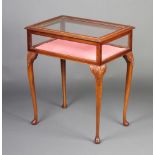 An Edwardian style rectangular inlaid mahogany bijouterie table raised on carved cabriole supports