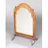A 1930's Queen Anne style arch plate dressing table mirror contained in a mahogany and walnut