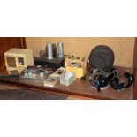 A World War Two German clockwork mine mechanism, an Air King radio model 222, 2 pairs of headphones,