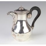 A Continental silver chocolate pot with repousse decoration and ebony handle, 211 grams gross