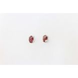 A pair of silver and pink tourmaline ear studs