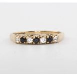 A 9ct yellow gold sapphire and diamond ring, size N, 1.5 grams