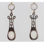 A pair of silver gilt cabochon moonstone and diamond earrings