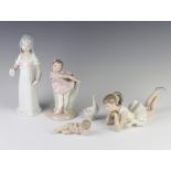 A Nao figure of a girl ballet dancer 8cm, a ditto reclining ballet dancer 22cm, 3 other figures