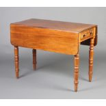 A Victorian mahogany Pembroke table fitted a drawer, raised on turned supports 69cm h x 91cm w x