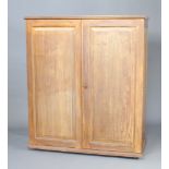 A 1920's "Ingenuity Ingenaites Ltd" compactum style walnut wardrobe - the interior fitted a