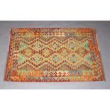 A brown, green and orange ground Chobi Kilim rug 160cm x 104cm