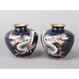 A pair of Japanese black ground cloisonne vases decorated dragons 9cm h together with a white