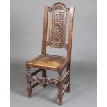 A Victorian 17th Century style hall chair with carved panel to the back, solid seat, raised on