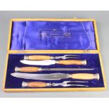 A cased horn handled, 5 piece carving set