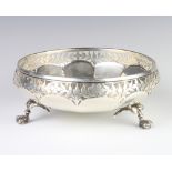 A silver lobed bowl with pierced floral rim, London 1913, by the Goldsmiths and Silversmiths Co.