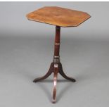 A Regency octagonal crossbanded mahogany wine table raised on pillar and tripod base 70cm h x 43cm w