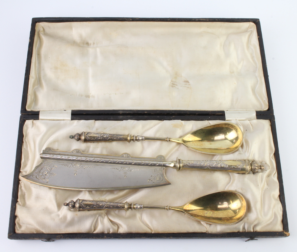 A 19th Century Continental 800 standard serving set comprising knife and 2 gilt decorated spoons,