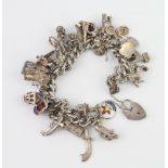 A silver charm bracelet 133 grams