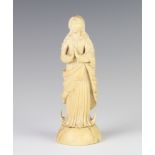 A 19th Century Dieppe ivory figure of a standing lady in supplication 15cm