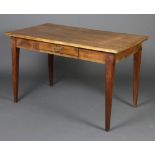 A French 19th Century rectangular pine table with fitted drawer, raised on square tapered supports