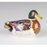 A Royal Crown Derby Imari pattern paperweight in the form of a duck with gold stopper 14cm