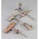 A 19th Century polished steel corkscrew with carved bone handle together with 3 other corkscrews