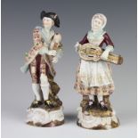 A pair of Volkstadt figures of a lady and gentleman musicians, raised on rococo bases 18cm Both