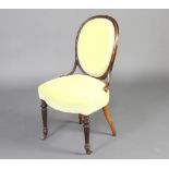 A 19th Century French walnut salon chair raised on turned and fluted supports upholstered in mint