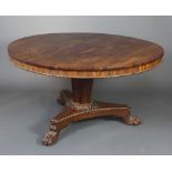 A William IV circular rosewood snap top breakfast table raised on a chamfered turned column and