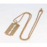 A 9ct yellow gold razor blade pendant and chain 16 grams