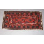 A black and blue ground Ghalmori Kilim rug 200cm x 100cm