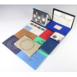 Seven uncased, uncirculated coin sets, an FDC, a silver commemorative stamp and minor coins