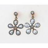 A pair of silver gilt topaz and diamond daisy style earrings