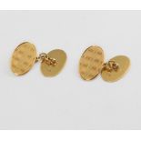 A pair of 18ct yellow gold engine turned oval cufflinks 5.9 grams