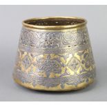 A Turkish brass and silvered pot of waisted form 14cm diam x 19cm h