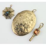 A Victorian watch key with hardstone mounts, locket and pendant