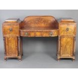 A Regency mahogany drop pedestal sideboard, the pedestals fitted a cupboard above cupboard and