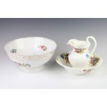 A 19th Century English porcelain pedestal bowl decorated with flowers 29cm, a Coalport miniature jug