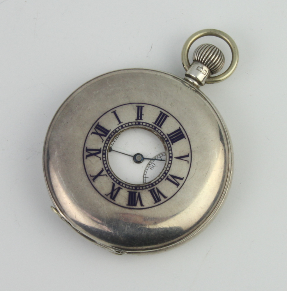 An Edwardian silver half hunter pocket watch, the dial inscribed Waltham, Birmingham 1904 The dial