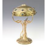An Art Nouveau gilt metal and glass table lamp, the shade set cut glass roundels 37cm h x 24cm diam.