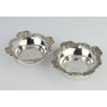 A pair of repousse silver bon bon dishes with floral decoration, 12cm, 104 gramsThe hallmarks are