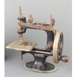 A child's Singer sewing machine (clamp missing)