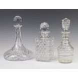 A 19th Century mallet shaped decanter and stopper 26cm, a ships decanter 28cm and a square spirit