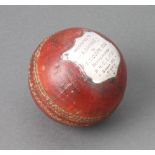 A H Gradidge and Sons presentation cricket ball with silver plaque marked "Presented to B Gamble