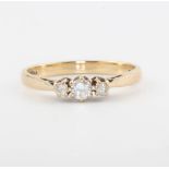 A 9ct yellow gold 3 stone diamond ring, size L 1/2, 1.7 grams