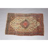 A Caucasian green, red and blue rug with central medallion within a 3 row border 172cm x 106cm The