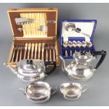 A silver plated 4 piece tea and coffee set with ebony mounts and 2 cased sets