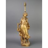 An Art Nouveau French spelter figure Mignon, converted to a table lamp 52cm h